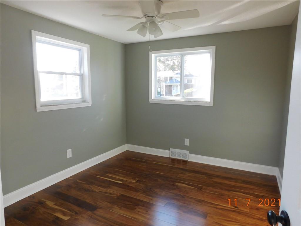41 Highbury Road Cheswick, PA 15024 - Photo 4 of 19 wooden floor in an empty room with a window