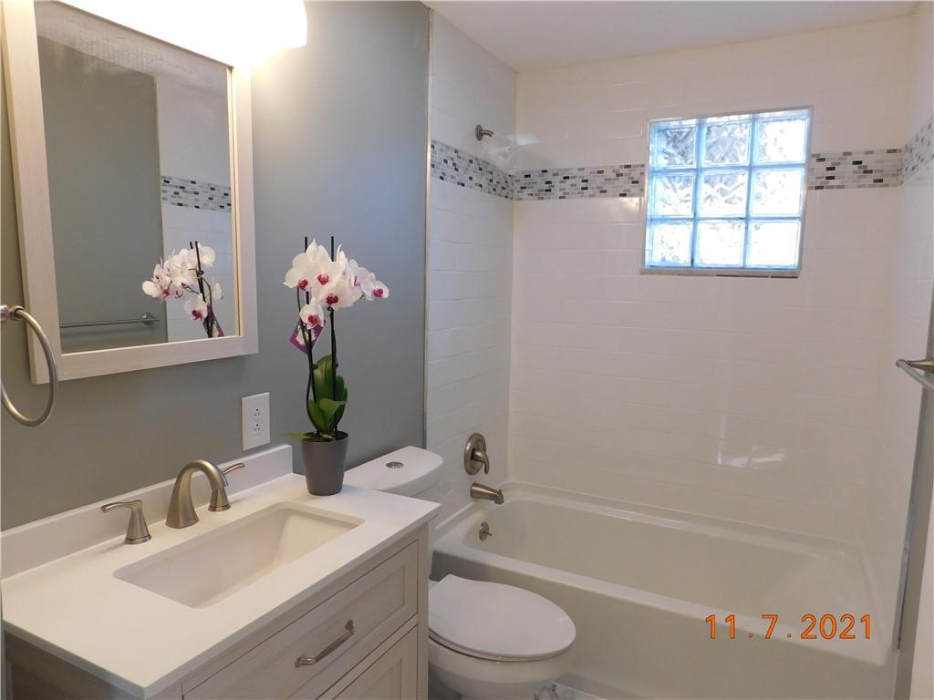 41 Highbury Road Cheswick, PA 15024 - Photo 5 of 19 a bathroom with a sink a toilet and shower