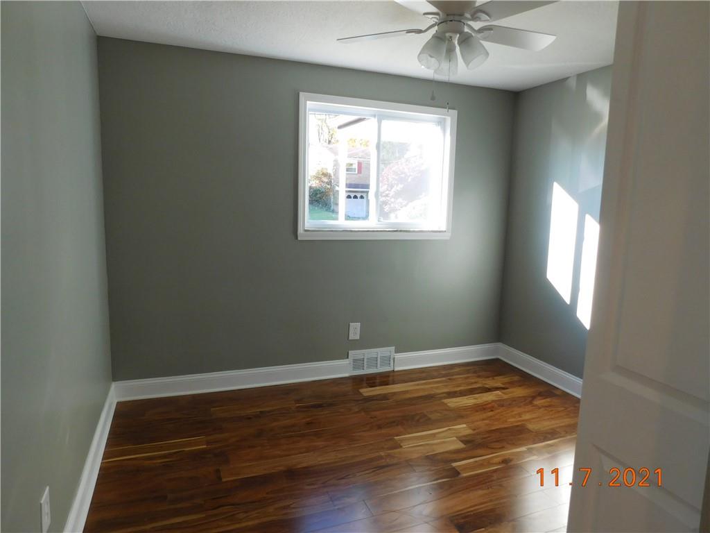 41 Highbury Road Cheswick, PA 15024 - Photo 6 of 19 wooden floor in an empty room with a window