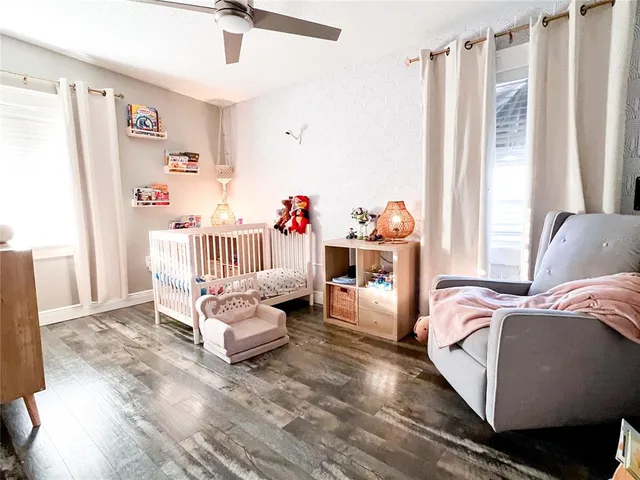 a bedroom with furniture and a window