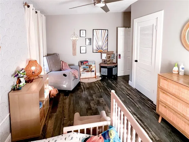 a bedroom with furniture and a window