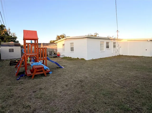 a view of a house with a cars park