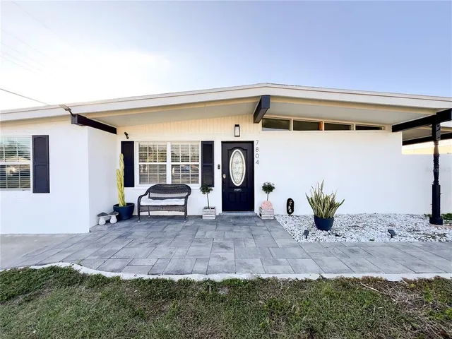 a view of front door and yard