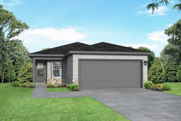 a front view of a house with a garden and yard