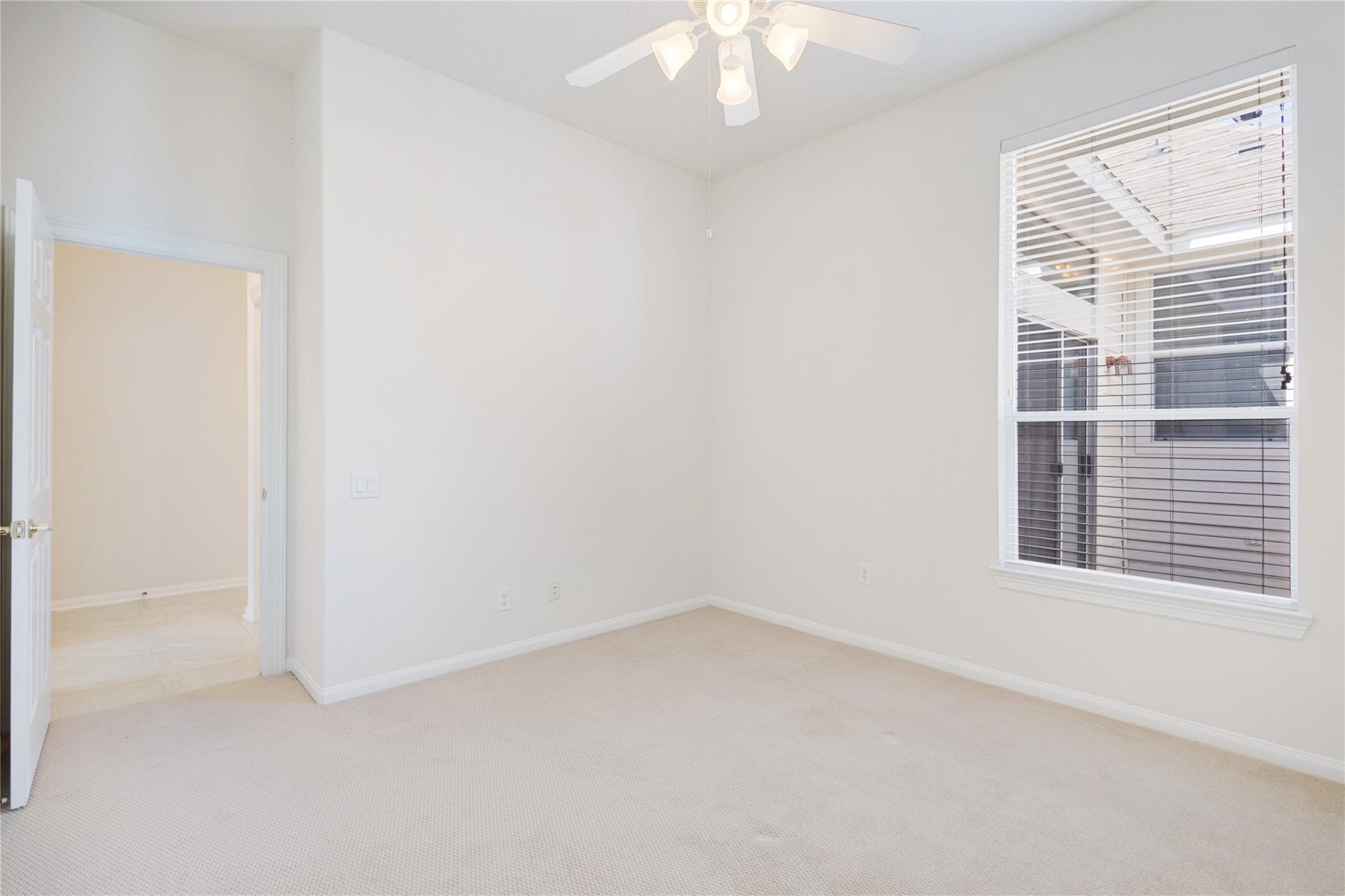 43 Tarrytown Way Conroe, TX 77384 - Photo 32 of 40 an empty room with a window