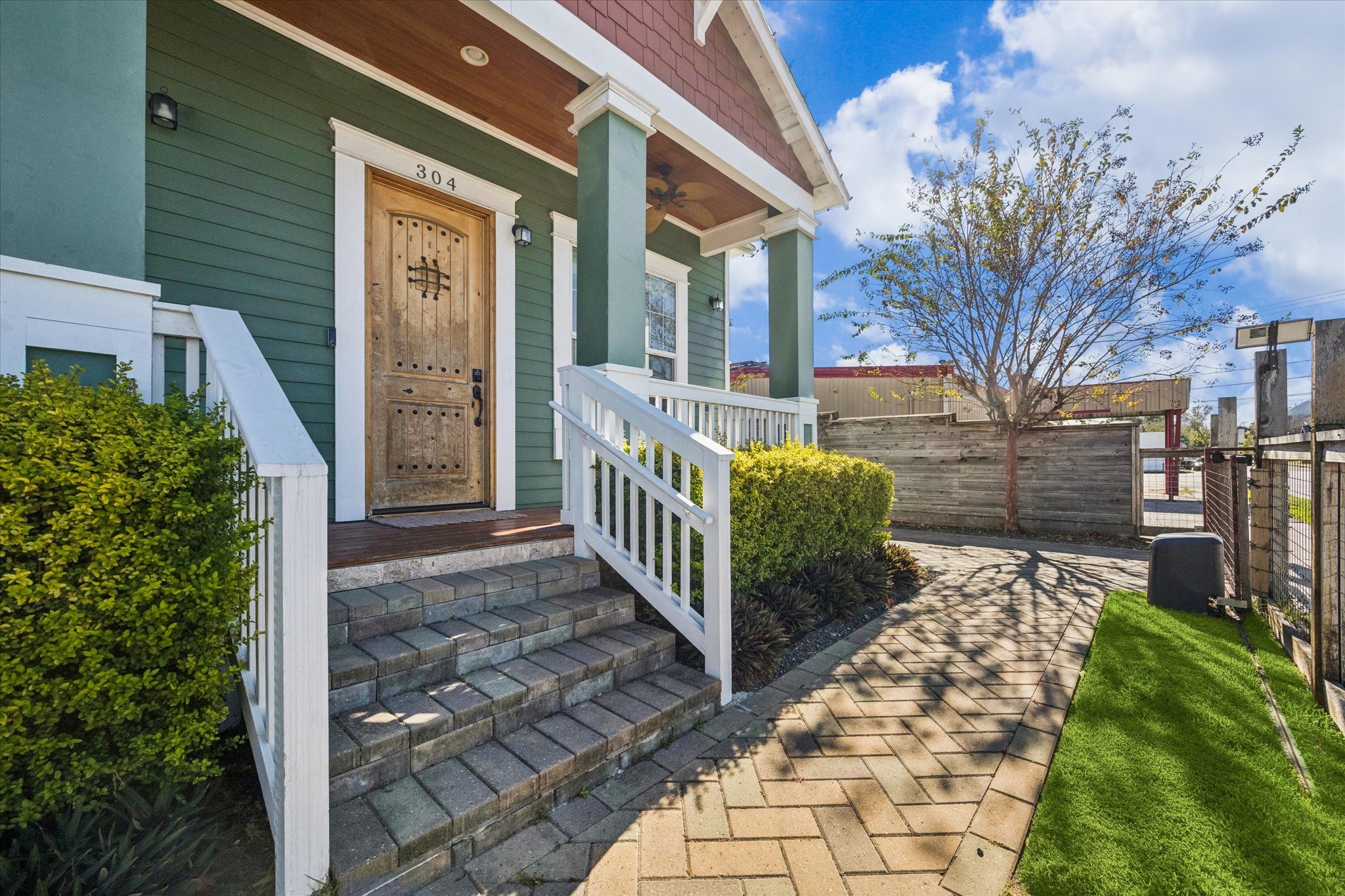 304 Walton Street Houston, TX 77009 - Photo 27 of 28 The home has front gate that opens up to the driveway and covered porch to enjoy.