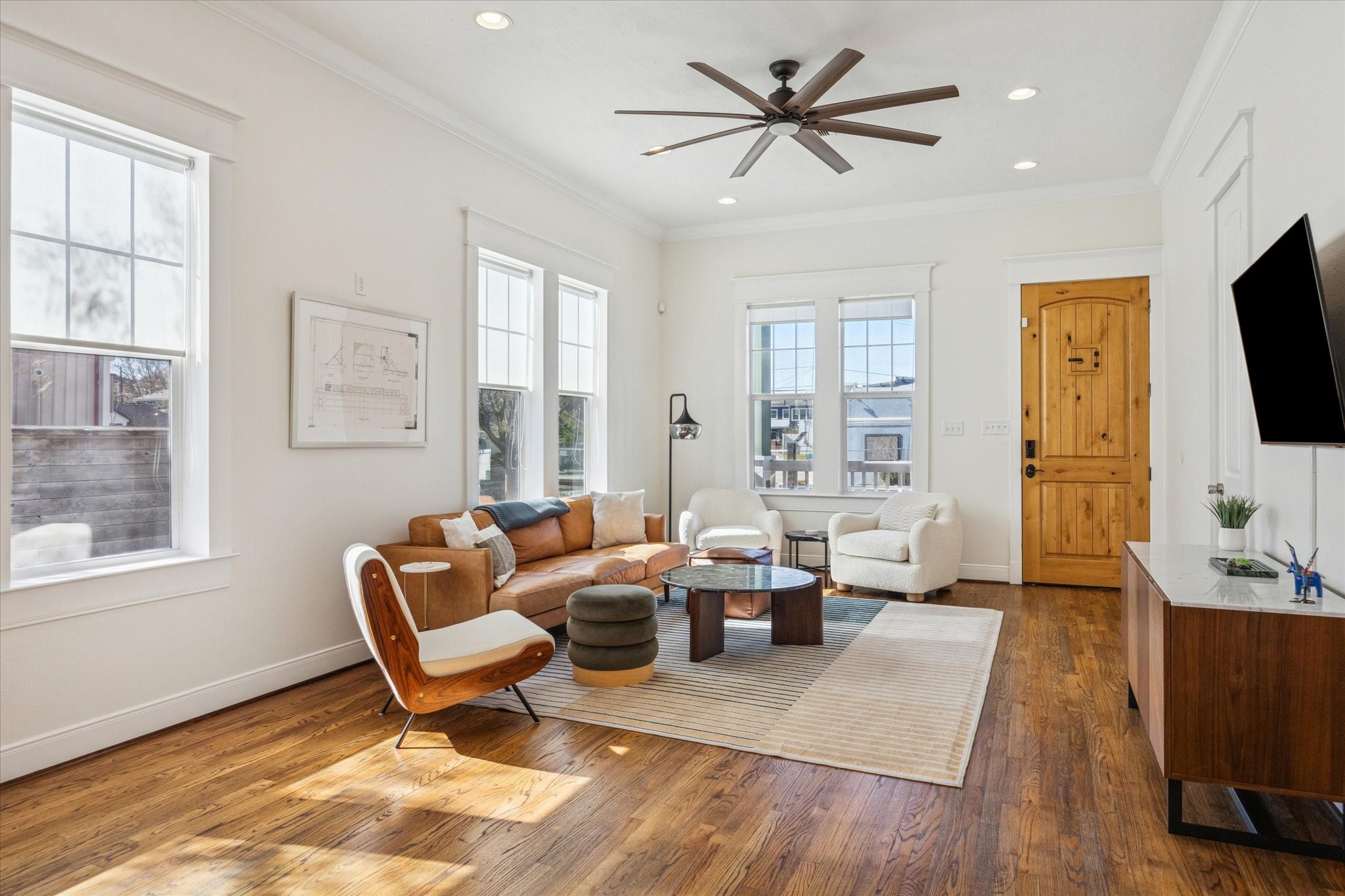 304 Walton Street Houston, TX 77009 - Photo 3 of 28 Stylish open concept living space with beautiful hardwood floors.