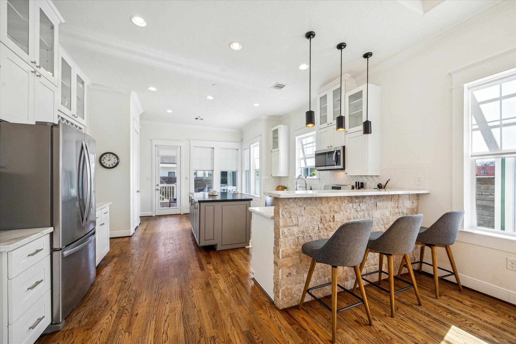304 Walton Street Houston, TX 77009 - Photo 9 of 28 The kitchen bar offers a comfortable flow along with natural lighting for a nice spot to enjoy anytime.