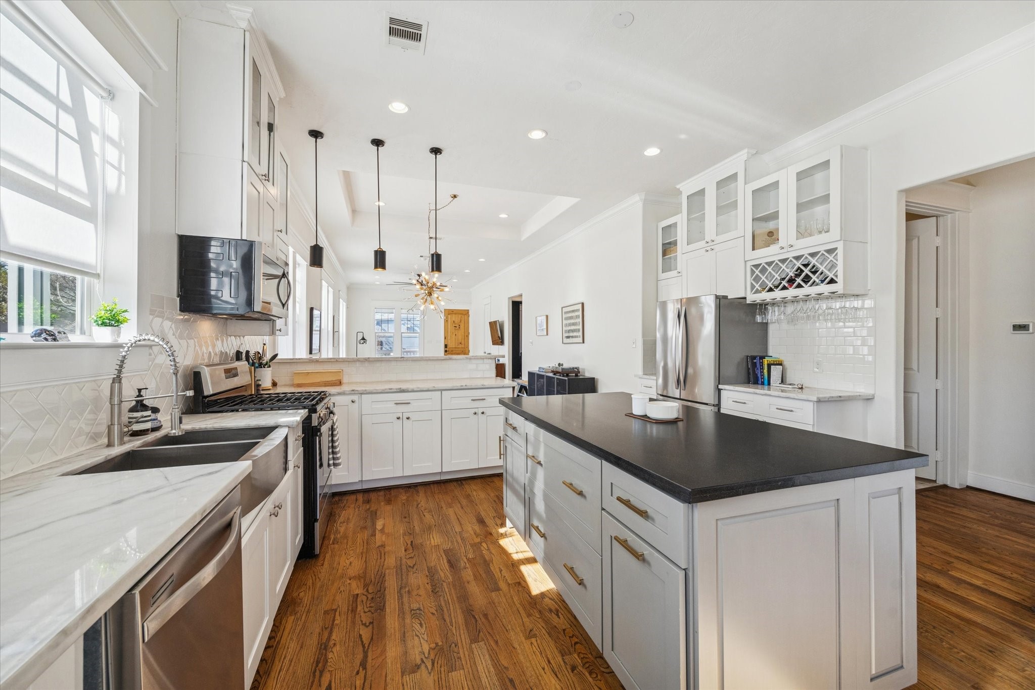 304 Walton Street Houston, TX 77009 - Photo 10 of 28 The kitchen offers a top notch gas stove top along with plenty of space for entertaining, cooking and more.