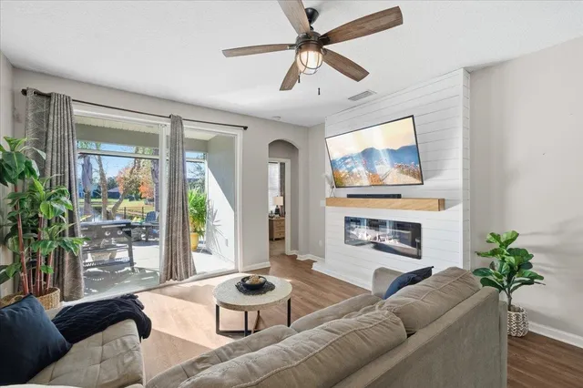 a living room with furniture and a fireplace