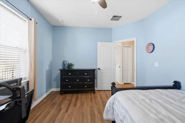 a bed room with a bed and a window