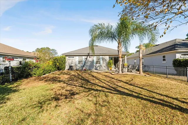a house with yard and swimming pool