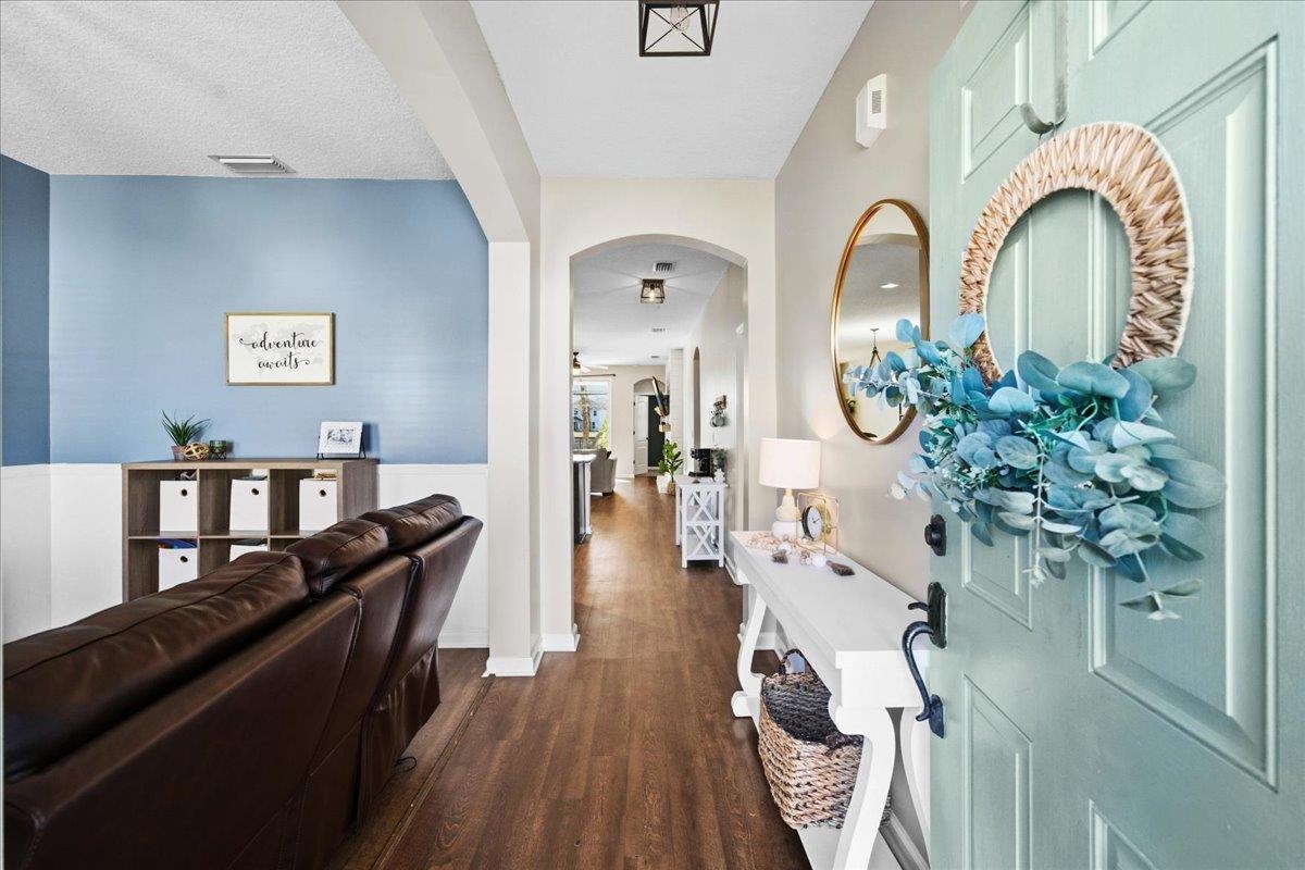 30 Levante Way St. Augustine, FL 32086 - Photo 5 of 40 a living room with furniture flowers and wooden floor