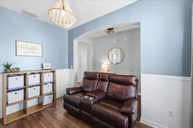a view of a livingroom with furniture and wooden floor