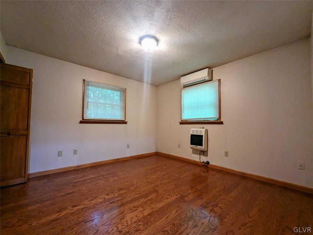 2461 Mountain Road Stroudsburg, PA 18360 - Photo 30 of 40 an empty room with wooden floor and windows
