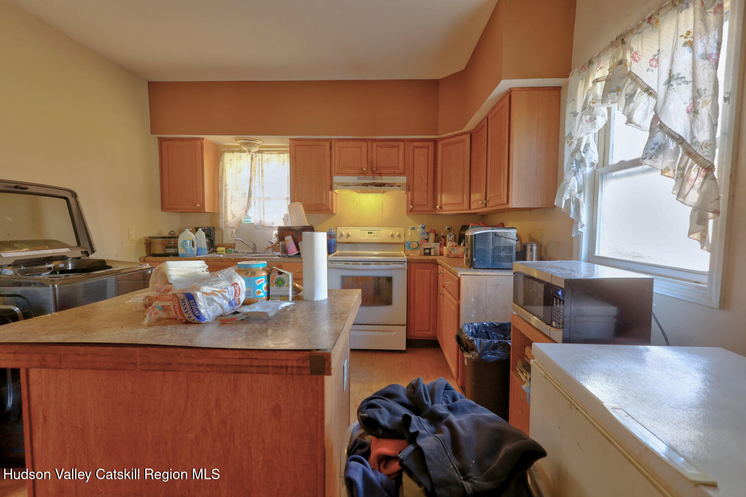 60 North Street Catskill, NY 12414 - Photo 17 of 50 a kitchen with a sink appliances and cabinets