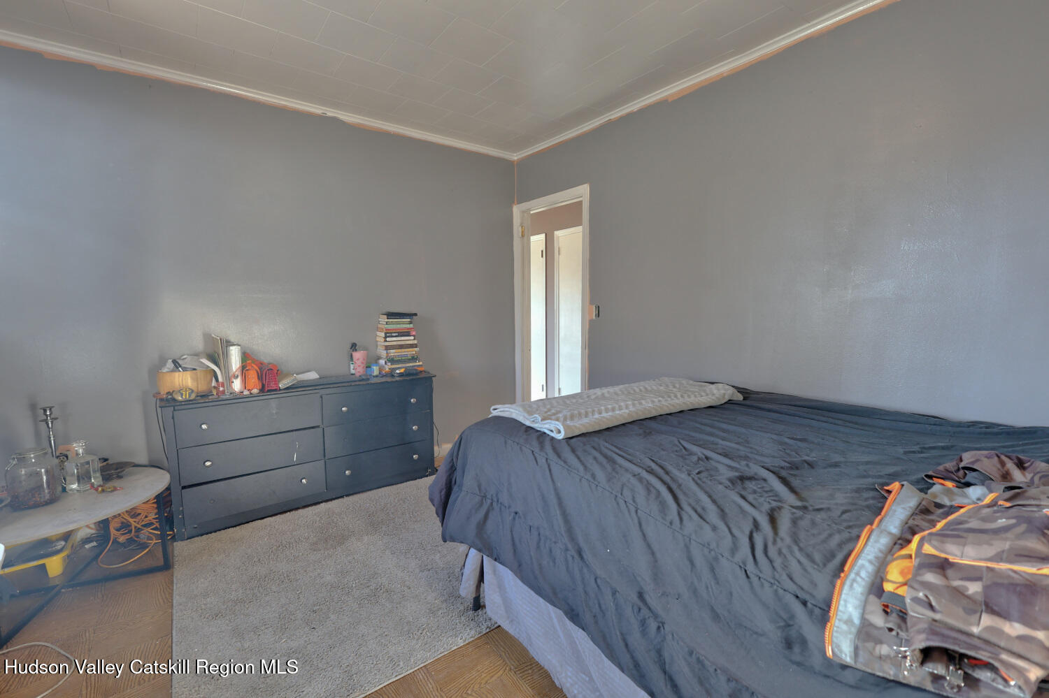 60 North Street Catskill, NY 12414 - Photo 28 of 50 a bed room with a bed and a dresser