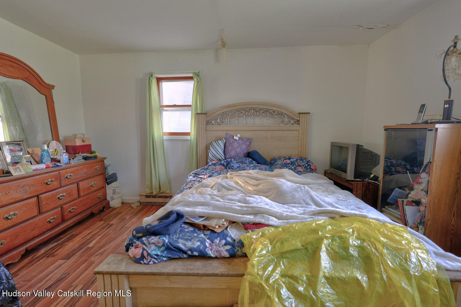 60 North Street Catskill, NY 12414 - Photo 39 of 50 a bedroom with a bed and a dresser in it