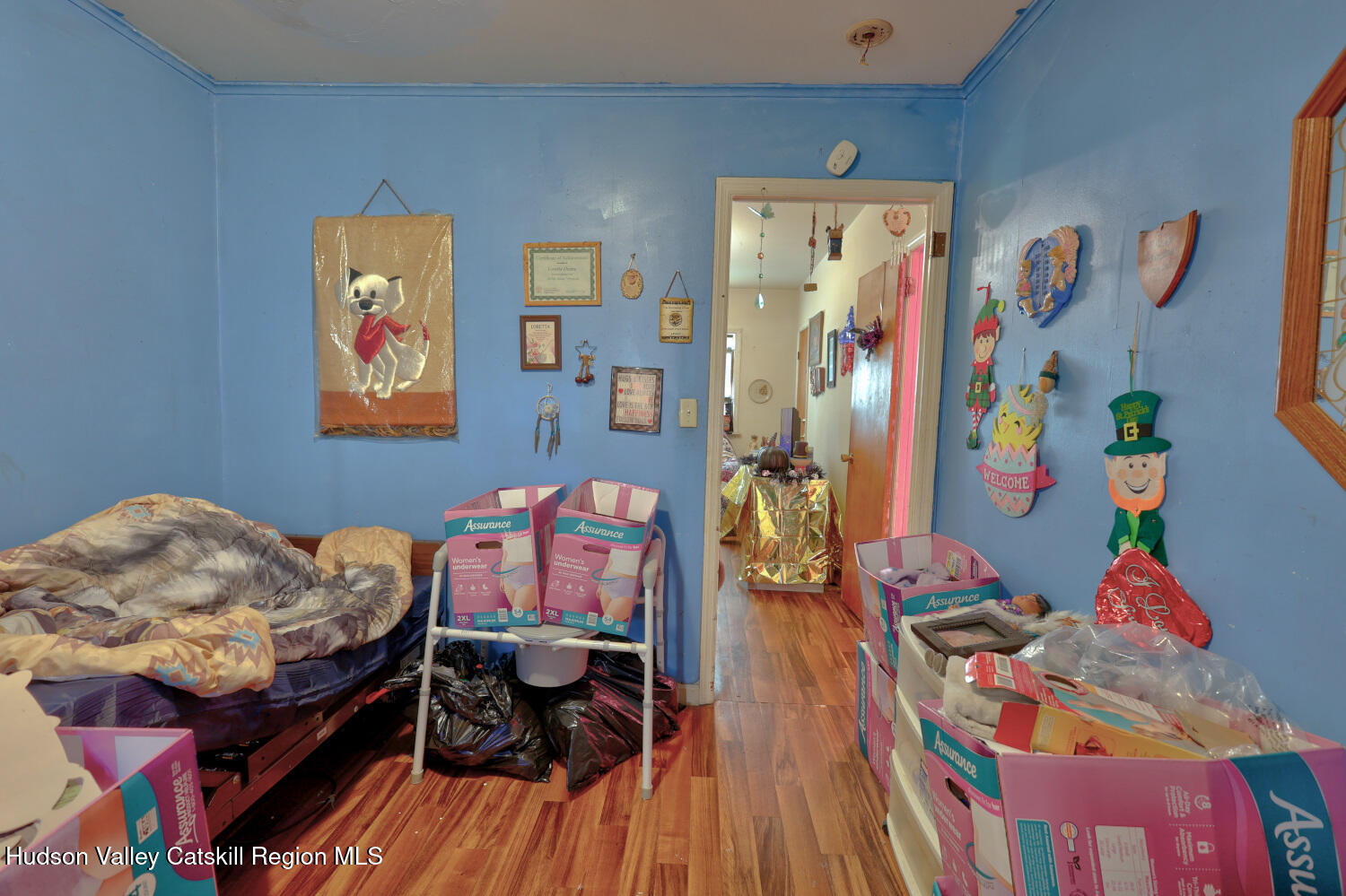 60 North Street Catskill, NY 12414 - Photo 41 of 50 a bedroom with baby bed and a wooden floor