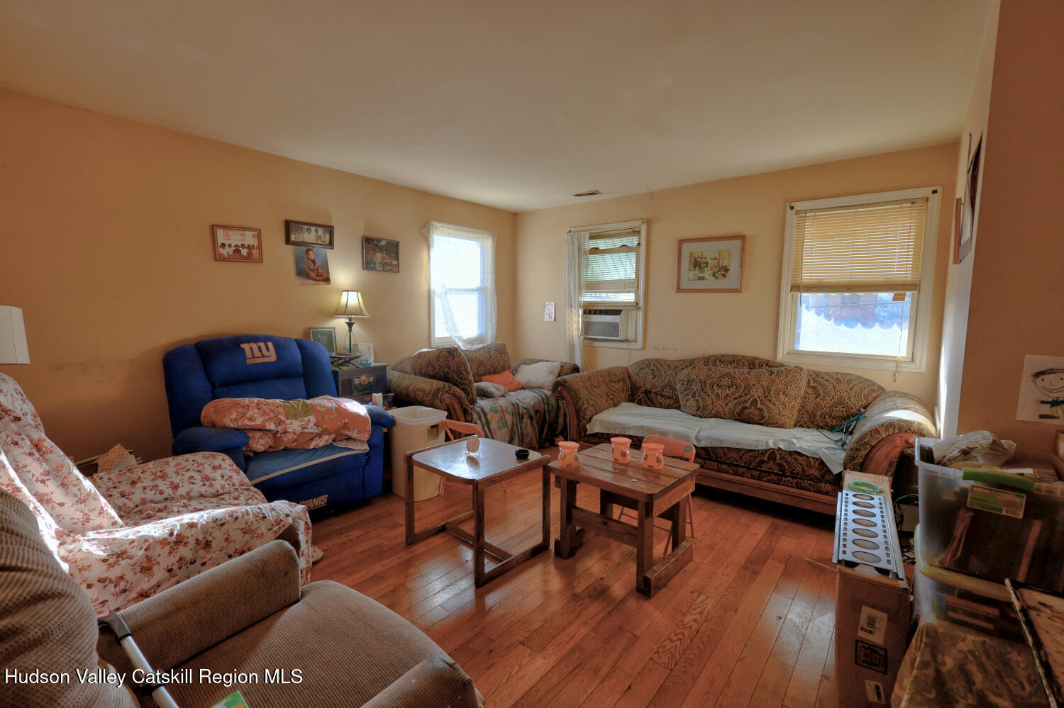 60 North Street Catskill, NY 12414 - Photo 5 of 50 a living room with furniture a wooden floor and a window