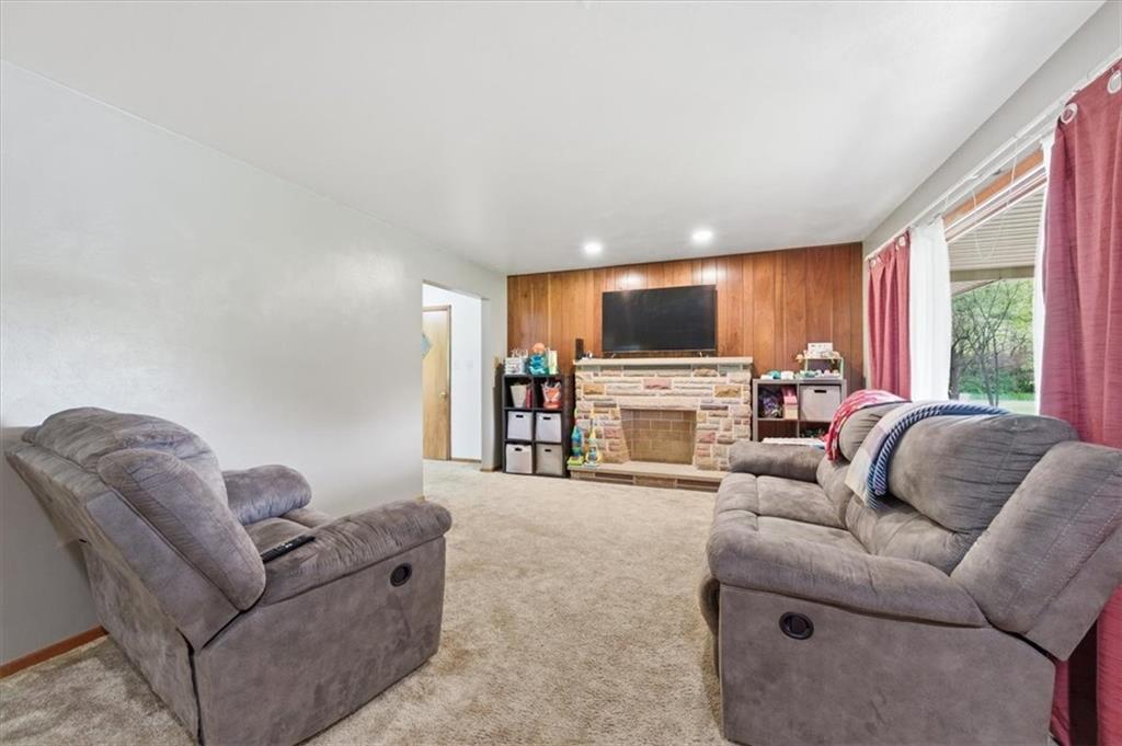 795 Geidel Road Ford City, PA 16226 - Photo 6 of 35 a living room with furniture a fireplace and a flat screen tv
