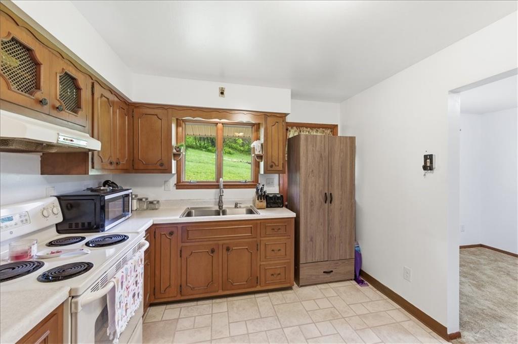795 Geidel Road Ford City, PA 16226 - Photo 9 of 35 a kitchen with a sink stove and refrigerator