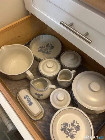 a table with chairs and a stove