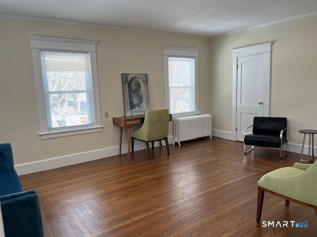 1946 Chapel Street New Haven, CT 06515 - Photo 5 of 23 a living room with furniture and a wooden floor