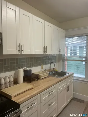 a kitchen with a sink and cabinets