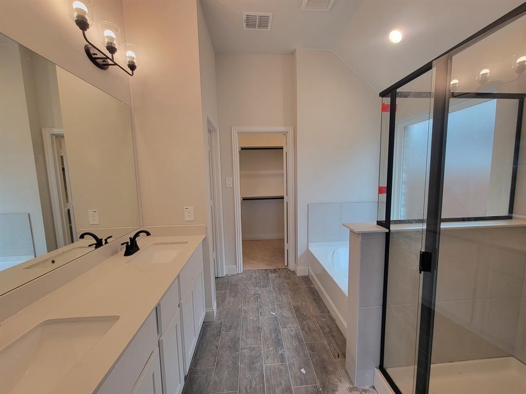5032 Picasso Road Royse City, TX 75189 - Photo 11 of 15 a bathroom with a double vanity sink and a mirror