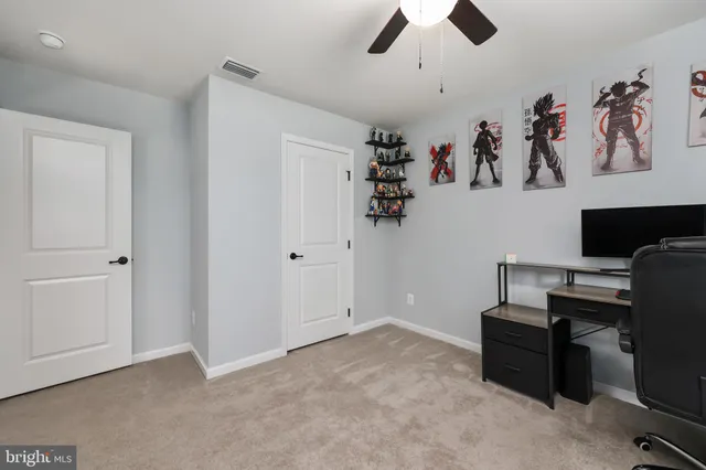 a view of a workspace with furniture