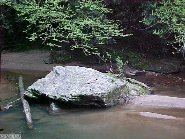 40.6-acres Wiles Ridge Road Hays, NC 28635 - Photo 5 of 18 ROCK ON SIDE OF RIVER