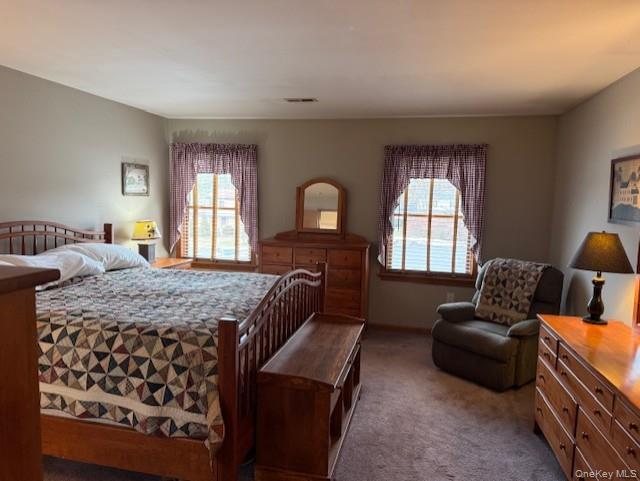 4 Grapevine Place Poughkeepsie, NY 12603 - Photo 18 of 31 a bedroom with a bed and wooden floor