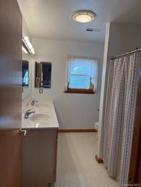 4 Grapevine Place Poughkeepsie, NY 12603 - Photo 21 of 31 a bathroom with a sink and a mirror