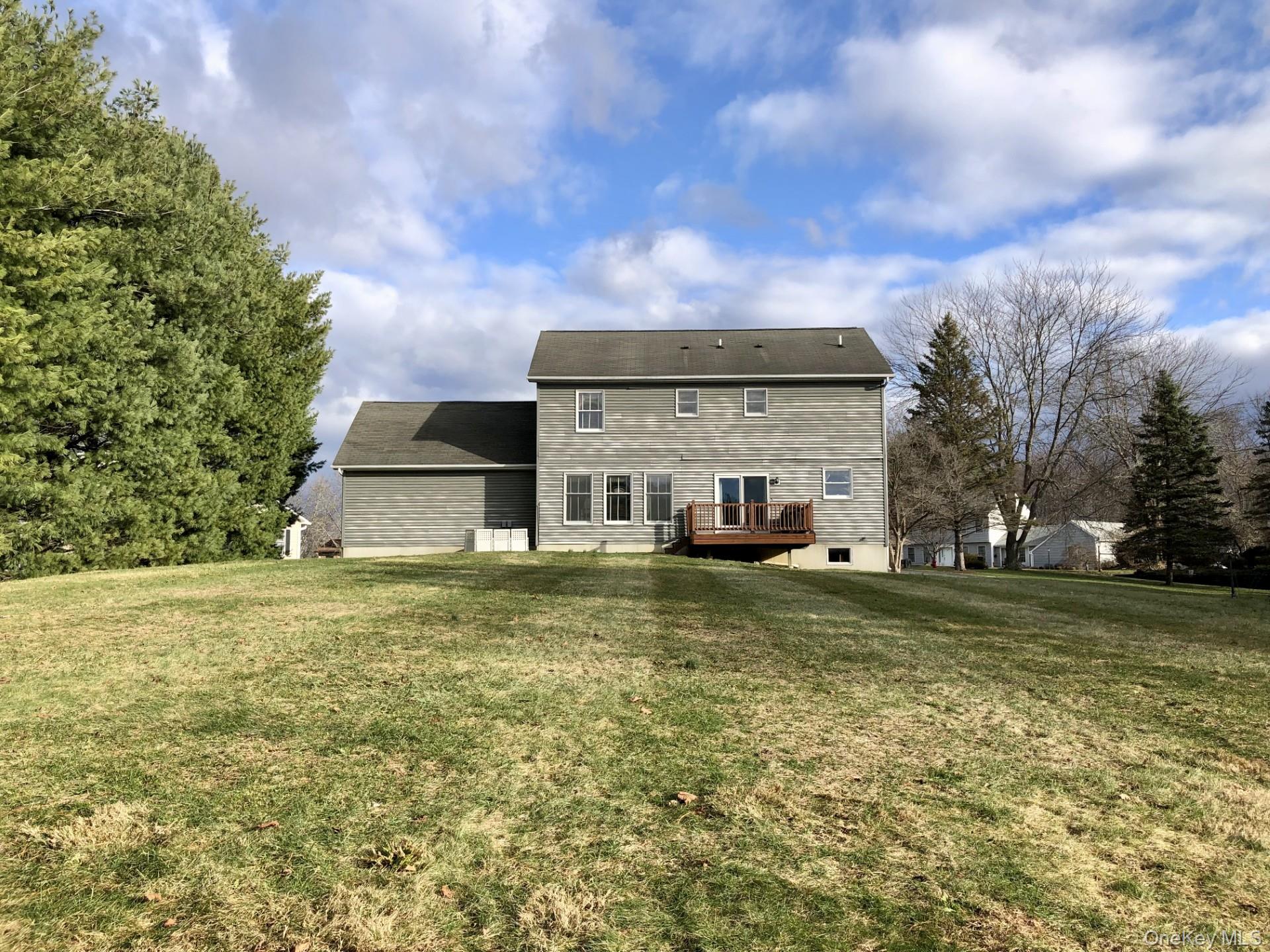 4 Grapevine Place Poughkeepsie, NY 12603 - Photo 29 of 31 a view of a big house with a big yard and large trees