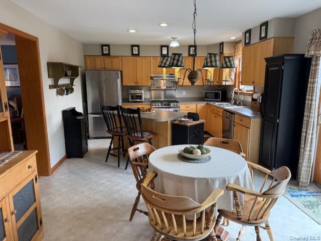 4 Grapevine Place Poughkeepsie, NY 12603 - Photo 9 of 31 a kitchen with a dining table and chairs