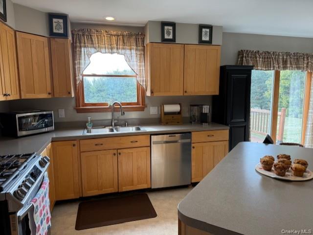 4 Grapevine Place Poughkeepsie, NY 12603 - Photo 10 of 31 a kitchen with sink a window and cabinets