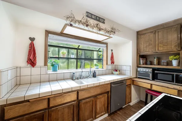 a bathroom with a sink a vanity and a mirror