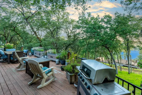a outdoor living space with patio furniture and a fireplace