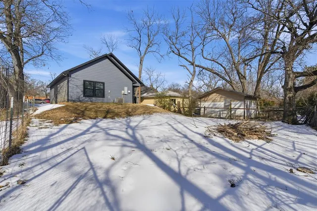 a picture of a bench in front of a wall