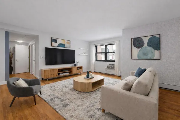 a living room with furniture and a flat screen tv