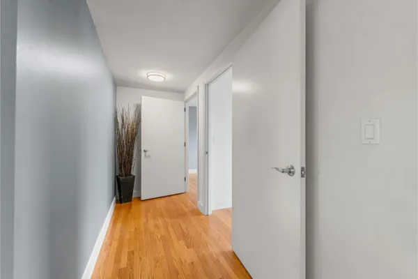 a view of a hallway with washer and dryer