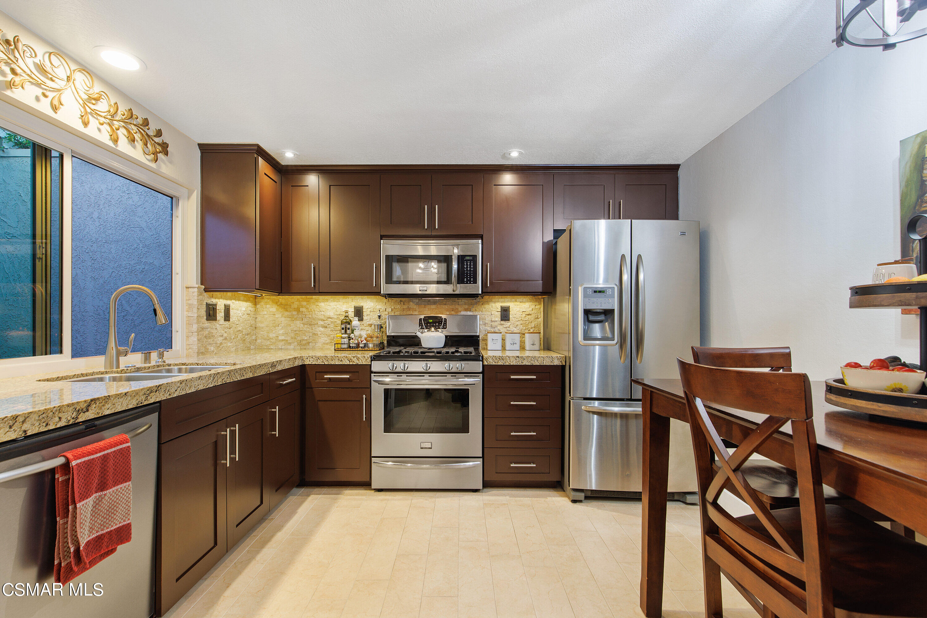 773 Congressional Road Simi Valley, CA 93065 - Photo 17 of 39 a kitchen with stainless steel appliances granite countertop a refrigerator stove microwave and sink