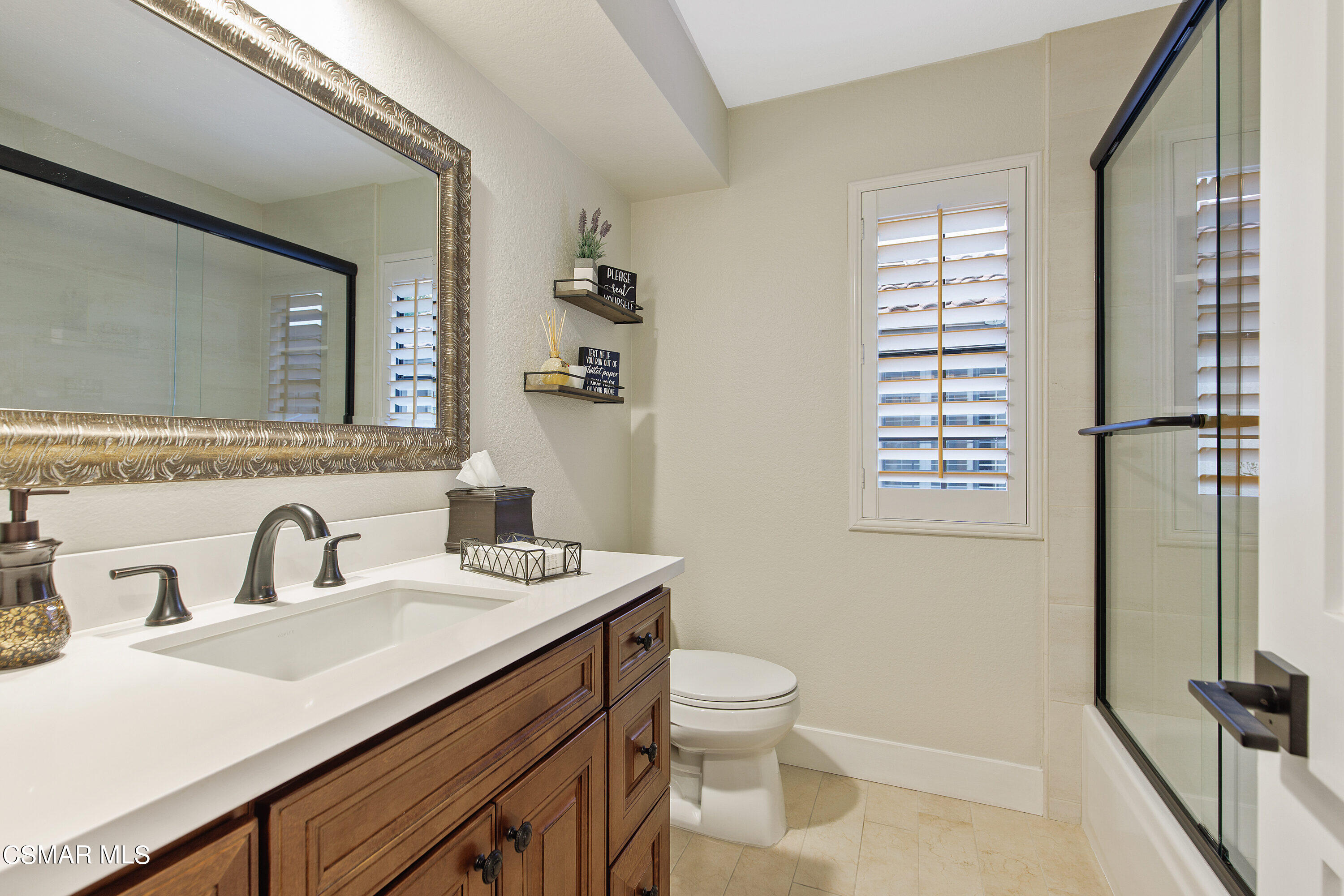 773 Congressional Road Simi Valley, CA 93065 - Photo 22 of 39 a bathroom with a sink a toilet and a mirror