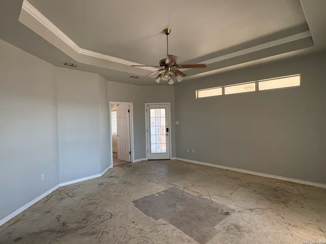 a view of a chandelier fan in a room