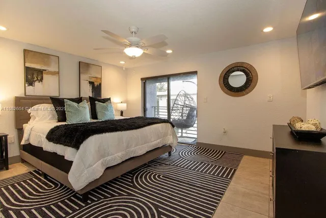 a bedroom with double bed and a window