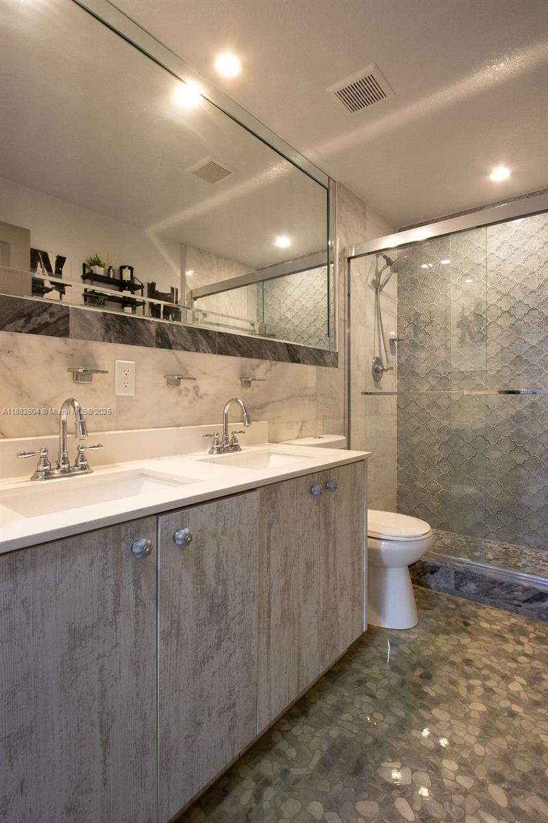 2061 Washington Avenue, Unit 4 Opa-Locka, FL 33054 - Photo 16 of 23 a bathroom with a sink toilet and shower