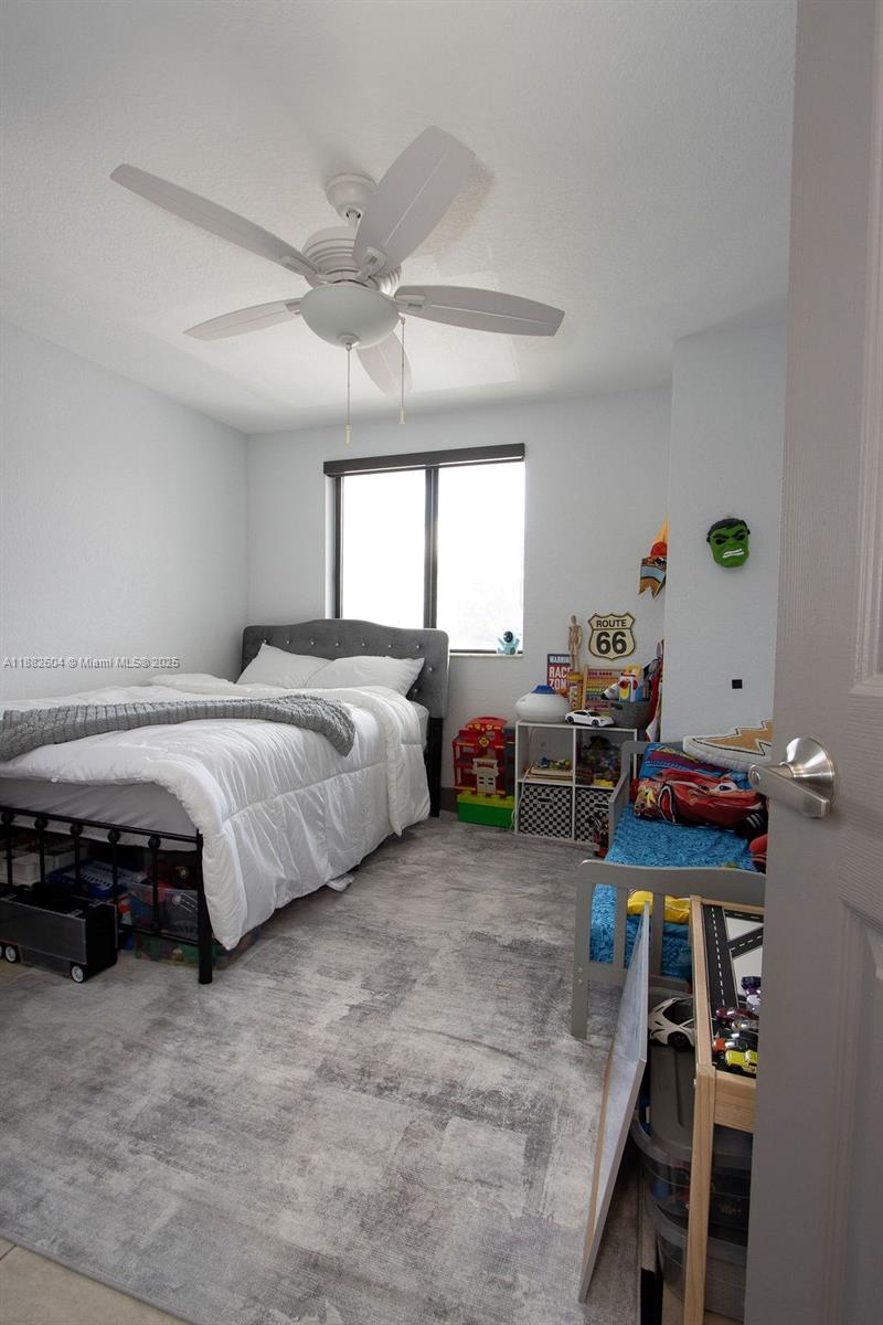 2061 Washington Avenue, Unit 4 Opa-Locka, FL 33054 - Photo 17 of 23 a bedroom with bed and a window