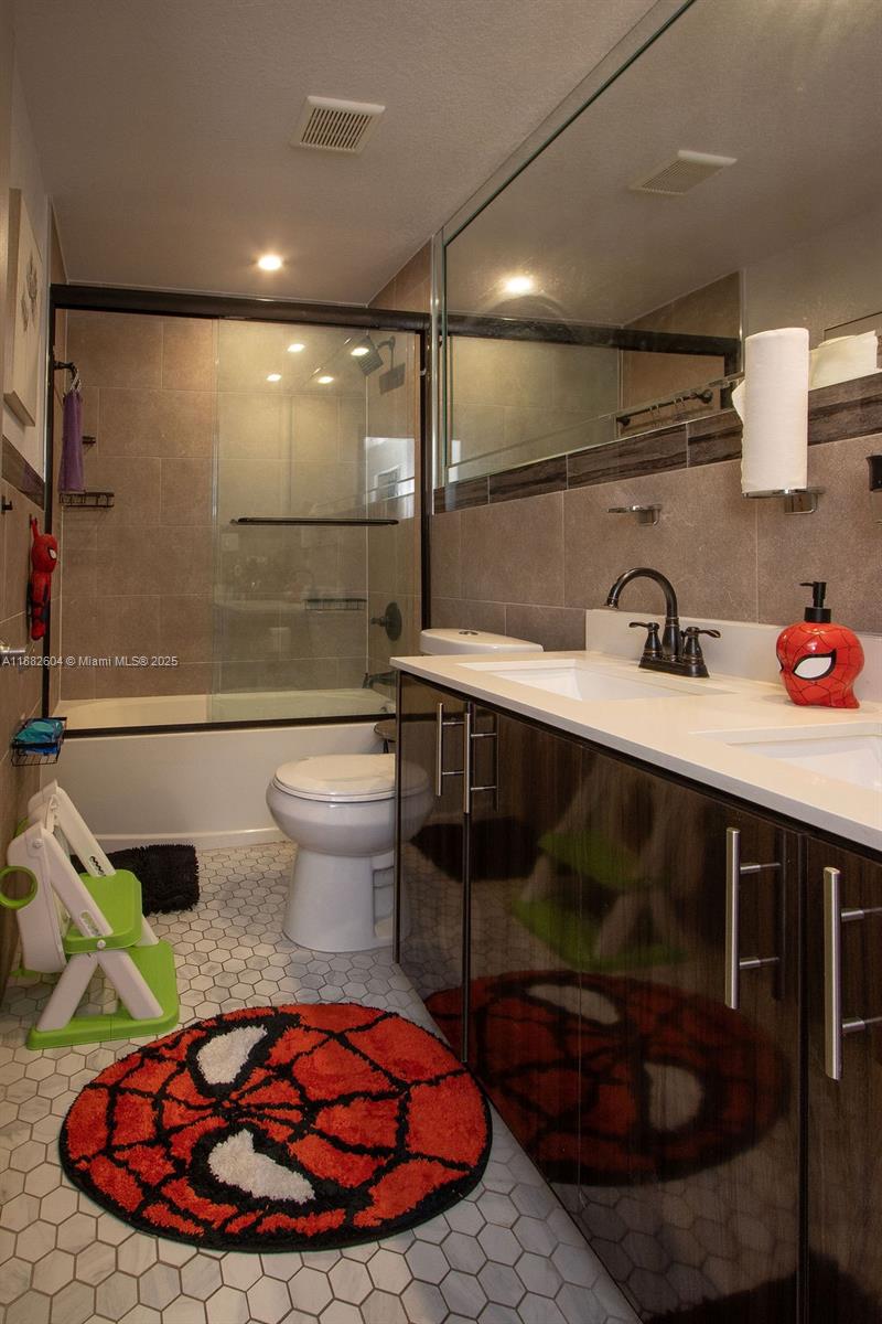 2061 Washington Avenue, Unit 4 Opa-Locka, FL 33054 - Photo 19 of 23 a bathroom with a sink toilet and shower