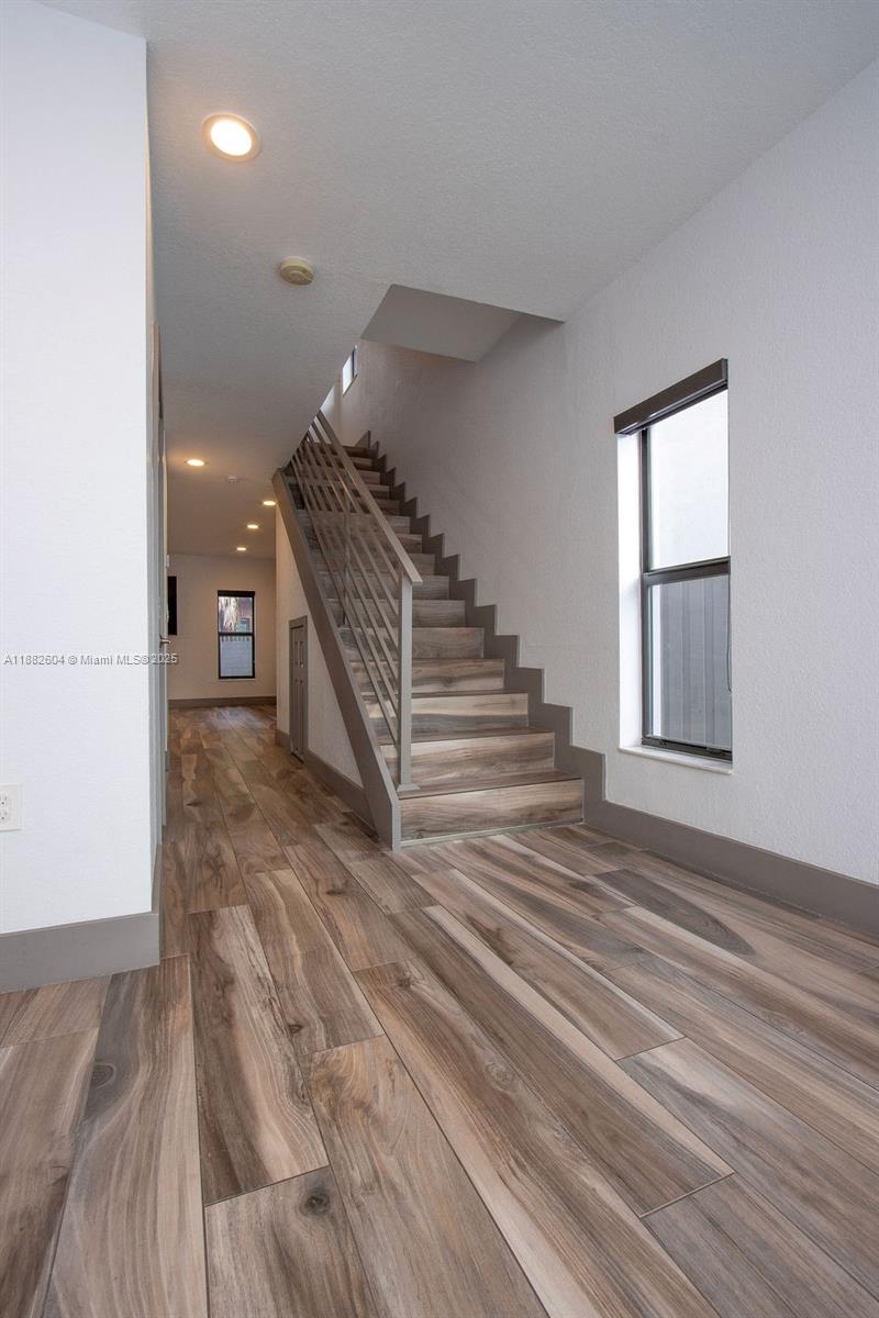 2061 Washington Avenue, Unit 4 Opa-Locka, FL 33054 - Photo 3 of 23 a view of entryway and hall with wooden floor